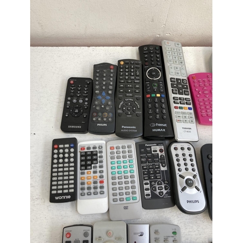 1340 - A collection of remote controls to include Philips, Panasonic, Bush, LG, Humax, Sky etc.