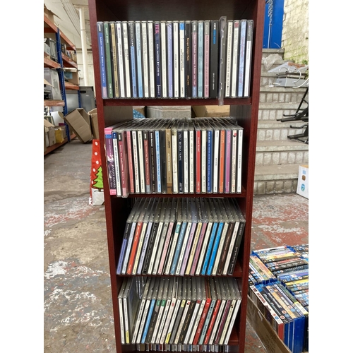 1352 - A CD storage unit containing a collection of classical music CDs