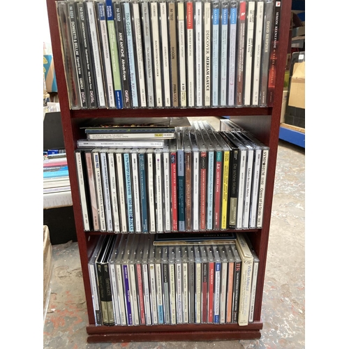 1352 - A CD storage unit containing a collection of classical music CDs