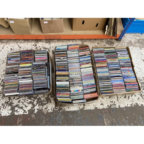 1356 - Three boxes containing a large collection of CDs and CD singles