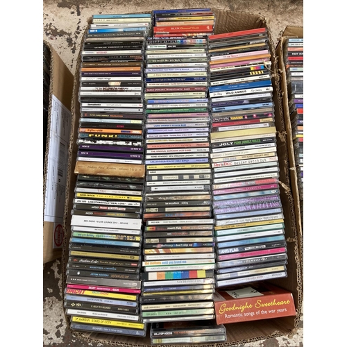 1356 - Three boxes containing a large collection of CDs and CD singles