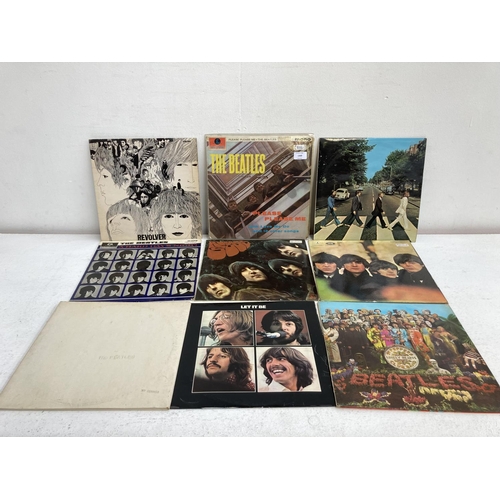 1369 - Nine LP vinyl records by The Beatles to include 'White Album' second pressing (No. 0109980), 'Please... 