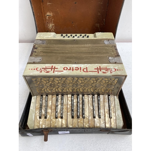 1390 - A cased Pietro twelve bass piano accordion