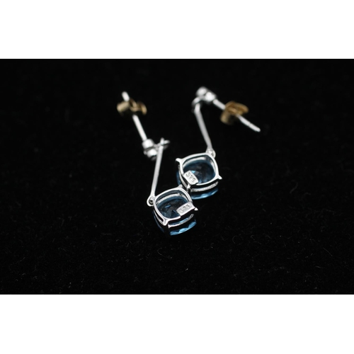 113 - A pair of 9ct white gold topaz and diamond drop earrings - approx. gross weight 1.6 grams