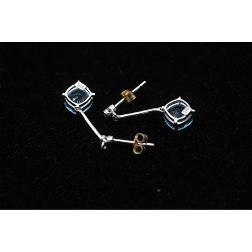 113 - A pair of 9ct white gold topaz and diamond drop earrings - approx. gross weight 1.6 grams