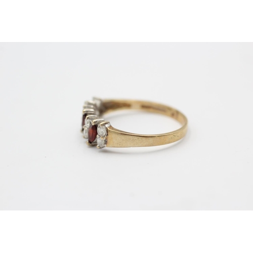 119 - A 9ct gold garnet and clear gemstone dress ring, size T - approx. gross weight 2.1 grams