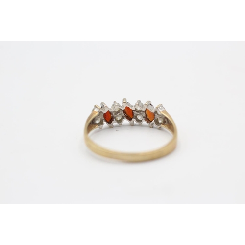 119 - A 9ct gold garnet and clear gemstone dress ring, size T - approx. gross weight 2.1 grams