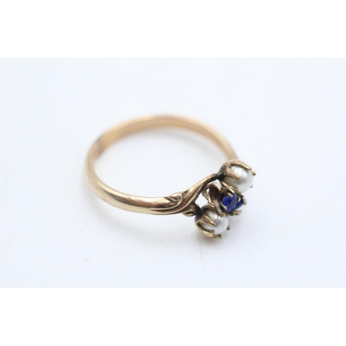 12 - A 9ct gold synthetic sapphire and faux pearl bypass ring, size S - approx. gross weight 2 grams