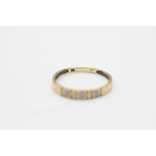 124 - A 9ct gold diamond two row band ring, size O½ - approx. gross weight 0.9 grams