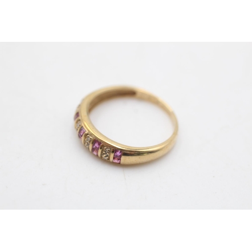 13 - A 9ct gold ruby and diamond dress ring, size N - approx. gross weight 1.7 grams