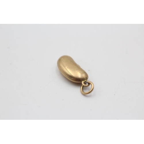 16 - A hallmarked Birmingham 9ct gold lucky bean pendant/charm - approx. gross weight 0.5 grams