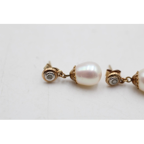 17 - A pair of 9ct gold diamond and cultured pearl drop earrings - approx. gross weight 2 grams