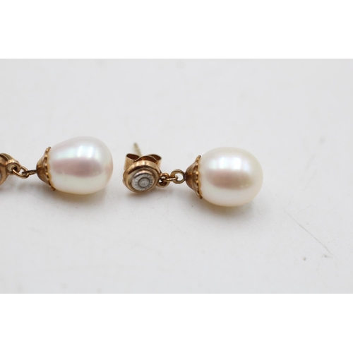 17 - A pair of 9ct gold diamond and cultured pearl drop earrings - approx. gross weight 2 grams