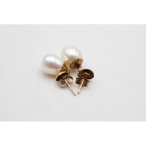 17 - A pair of 9ct gold diamond and cultured pearl drop earrings - approx. gross weight 2 grams