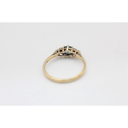 21 - A 9ct gold diamond and topaz dress ring, size N½ - approx. gross weight 1.4 grams