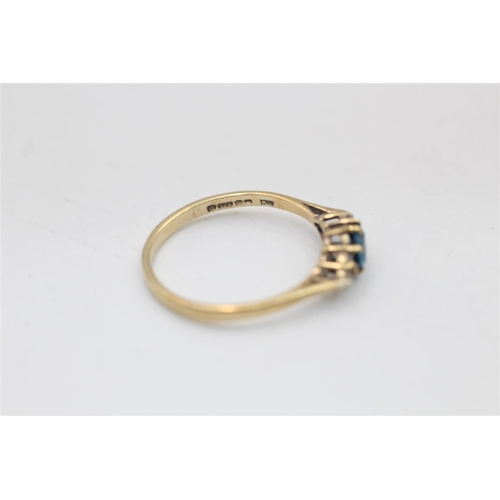 21 - A 9ct gold diamond and topaz dress ring, size N½ - approx. gross weight 1.4 grams