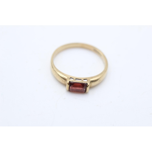 28 - Two 9ct gold gemstone solitaire dress rings, one garnet size N½ and one smoky quartz size Q½ - appro... 