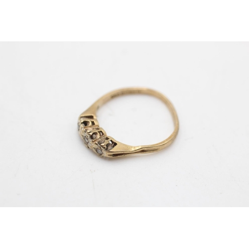 35 - A hallmarked Sheffield 9ct gold diamond three stone ring, size N½ - approx. gross weight 1.7 grams