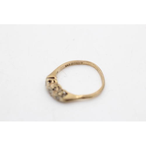 35 - A hallmarked Sheffield 9ct gold diamond three stone ring, size N½ - approx. gross weight 1.7 grams