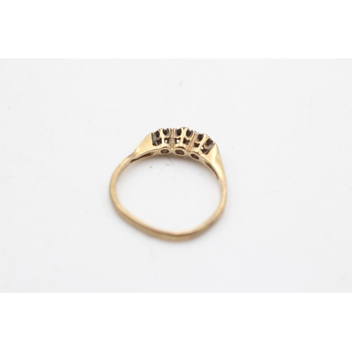 35 - A hallmarked Sheffield 9ct gold diamond three stone ring, size N½ - approx. gross weight 1.7 grams