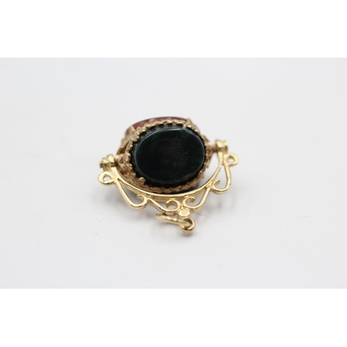 41 - Three 9ct gold fobs, one onyx, bloodstone and carnelian swivel, one onyx eagle's clutch and one anti... 