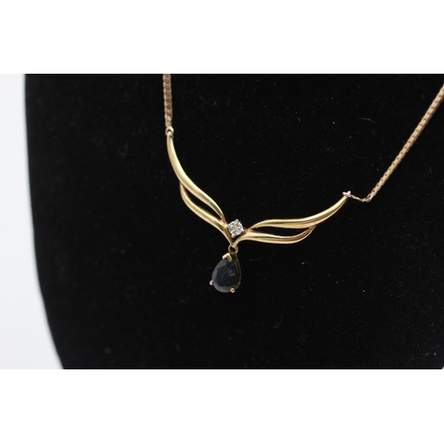52 - A 9ct gold diamond and sapphire drop static pendant necklace - approx. gross weight 3.4 grams
