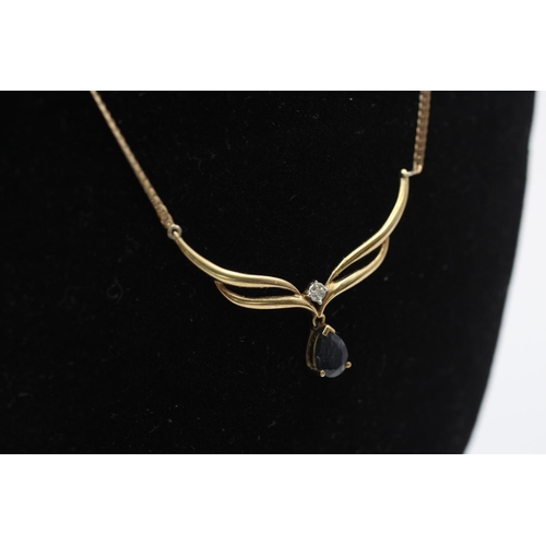 52 - A 9ct gold diamond and sapphire drop static pendant necklace - approx. gross weight 3.4 grams