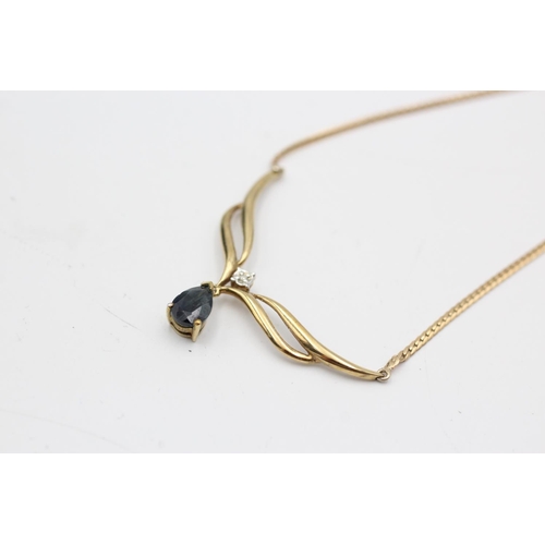 52 - A 9ct gold diamond and sapphire drop static pendant necklace - approx. gross weight 3.4 grams