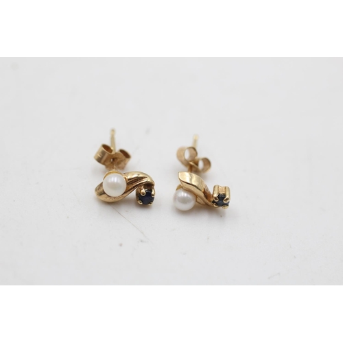 64 - Two pairs of 9ct gold pearl and gemstone stud earrings, one ruby and one sapphire - approx. gross we... 