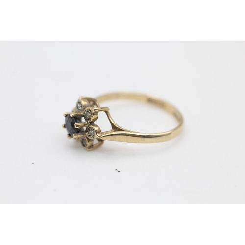 66 - A hallmarked Sheffield 9ct gold sapphire and diamond floral halo dress ring, size N - approx. gross ... 