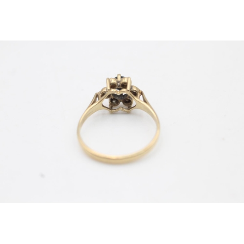 66 - A hallmarked Sheffield 9ct gold sapphire and diamond floral halo dress ring, size N - approx. gross ... 