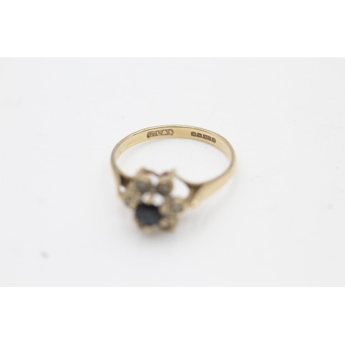 66 - A hallmarked Sheffield 9ct gold sapphire and diamond floral halo dress ring, size N - approx. gross ... 