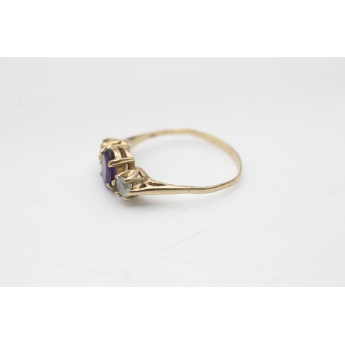 75 - A 9ct gold amethyst and topaz trilogy dress ring, size O½ - approx. gross weight 1.7 grams