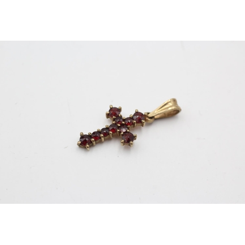 80 - Three 9ct gold gemstone pendants, one garnet cross, one emerald and one diamond solitaire - approx. ... 