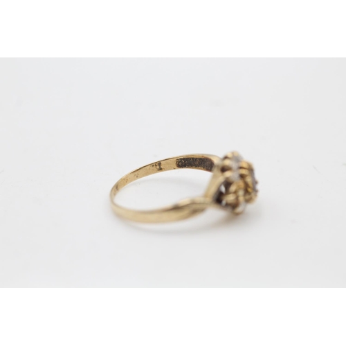 88 - A 9ct gold citrine and diamond cluster ornate dress ring, size Q½ - approx. gross weight 2.4 grams