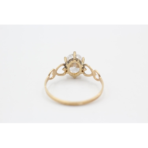 92 - A 9ct gold clear gemstone solitaire ring with openwork heart shoulders, size P½ - approx. gross weig... 