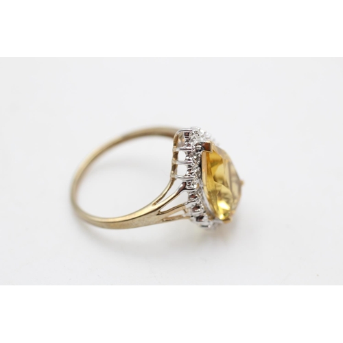 93 - A 9ct gold citrine and diamond tear shape cocktail ring, size R - approx. gross weight 3.3 grams