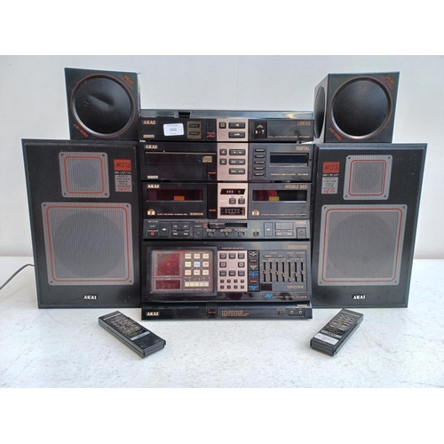 An Akai four piece hi-fi system comprising AV-M313L control centre