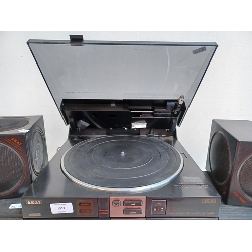 An Akai four piece hi-fi system comprising AV-M313L control centre