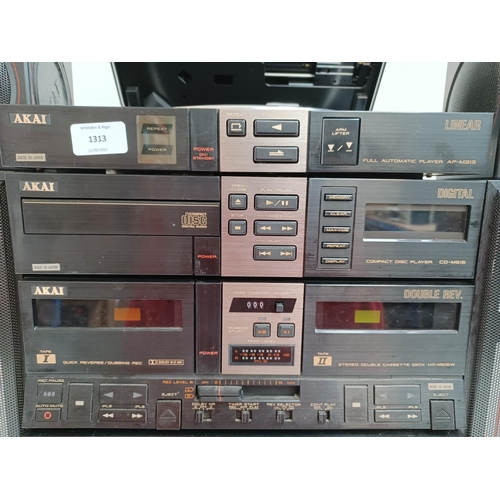 An Akai four piece hi-fi system comprising AV-M313L control