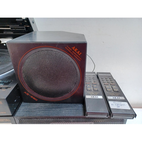 An Akai four piece hi-fi system comprising AV-M313L control centre