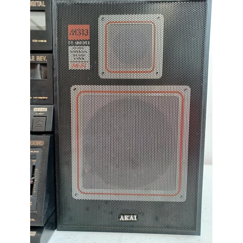 An Akai four piece hi-fi system comprising AV-M313L control