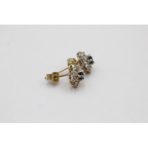 11 - A pair of 9ct gold diamond and sapphire floral cluster stud earrings - approx. gross weight 1.1 gram... 