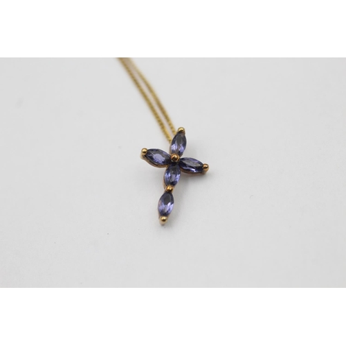 12 - A 9ct gold tanzanite cross pendant necklace - approx. gross weight 1.1 grams