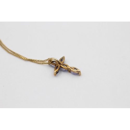 12 - A 9ct gold tanzanite cross pendant necklace - approx. gross weight 1.1 grams