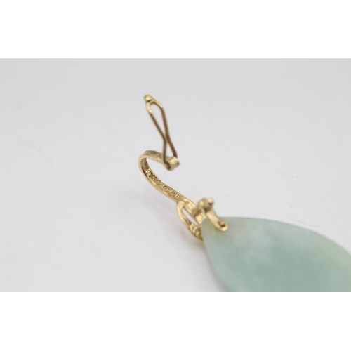 13 - A 14ct gold jade and diamond pendant - approx. gross weight 3.1 grams