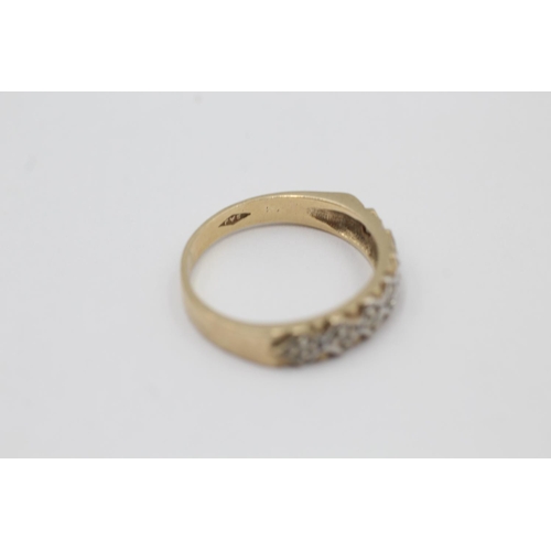 5 - A hallmarked Birmingham 9ct gold diamond seven stone ring, size M - approx. gross weight 2.3 grams