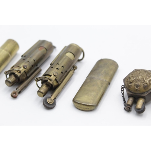 111 - Six antique brass cigarette lighters