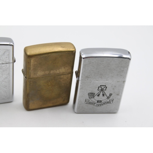 228 - Four assorted Zippo cigarette lighters