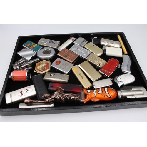 232 - Thirty two assorted cigarette lighters